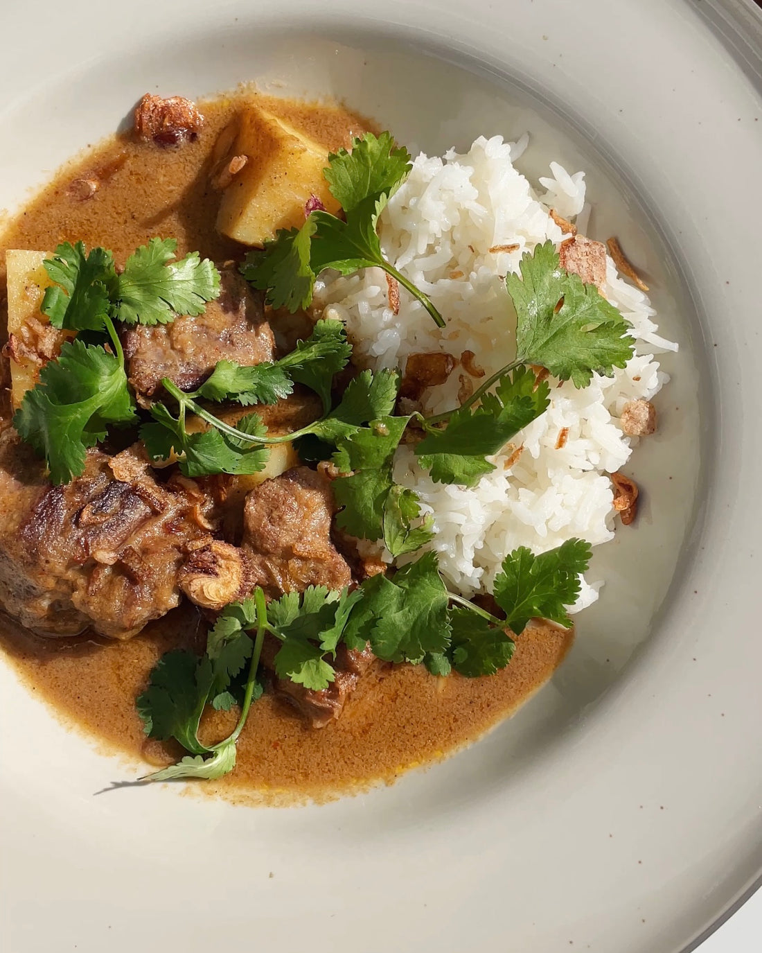 A bowl of Massaman curry on the left, and a photo of ingredients on the right. @intothesauce, Into the Sauce, Tori Falzon, #intothesauce